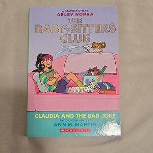 Scholastic Graphic Novel with Pink and Blue Cover